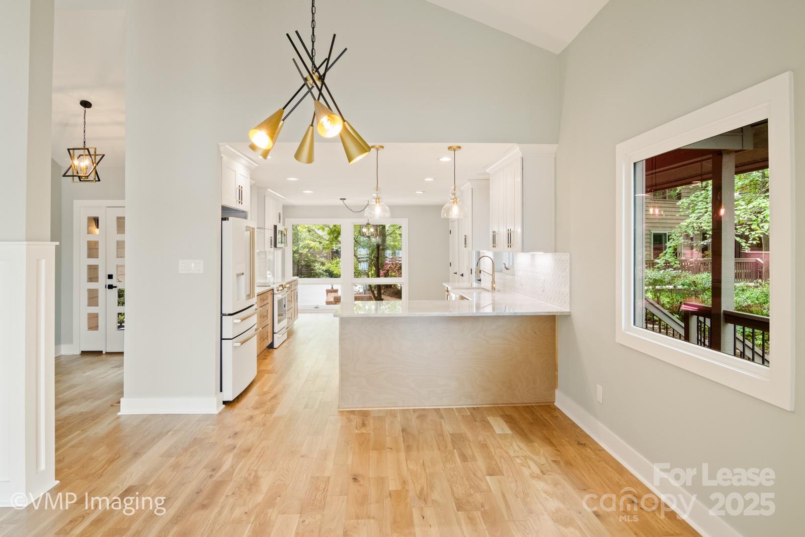 449 Windward Drive Davidson, NC 28036 - Photo 11 of 46 a view of kitchen and living room