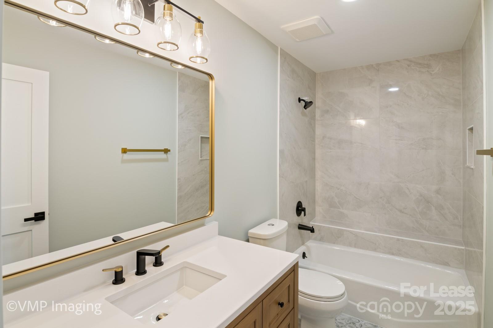 449 Windward Drive Davidson, NC 28036 - Photo 22 of 46 a bathroom with a sink a toilet and shower