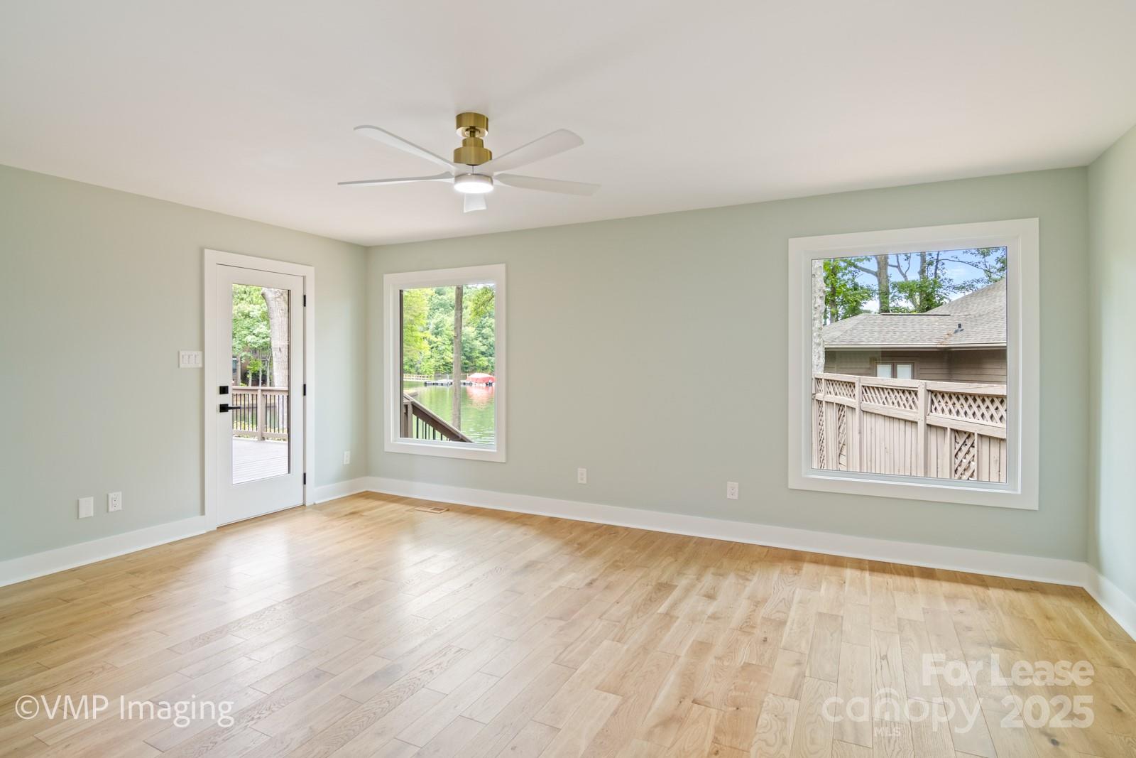 449 Windward Drive Davidson, NC 28036 - Photo 24 of 46 a view of an empty room with a window and wooden floor