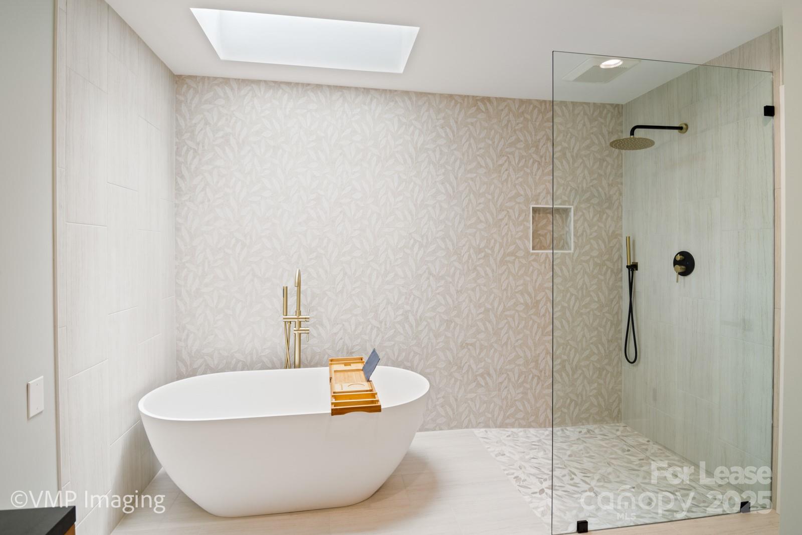 449 Windward Drive Davidson, NC 28036 - Photo 27 of 46 a white bath tub sitting next to a shower