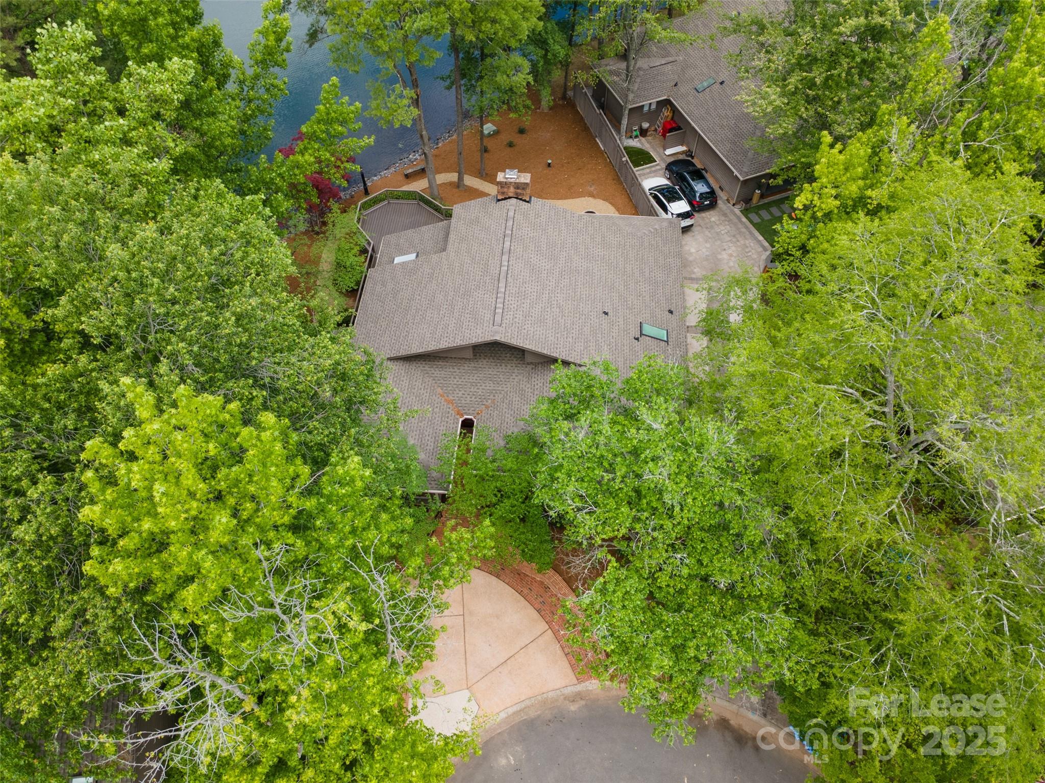 449 Windward Drive Davidson, NC 28036 - Photo 30 of 46 an aerial view of a house with a yard and a large tree