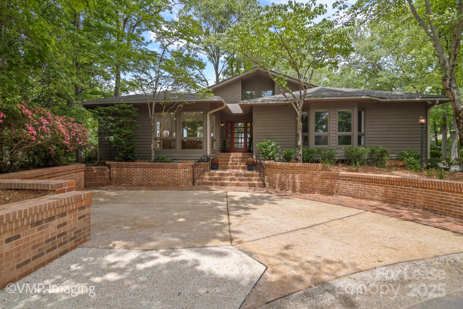 449 Windward Drive Davidson, NC 28036 - Photo 3 of 46 a front view of a house with yard