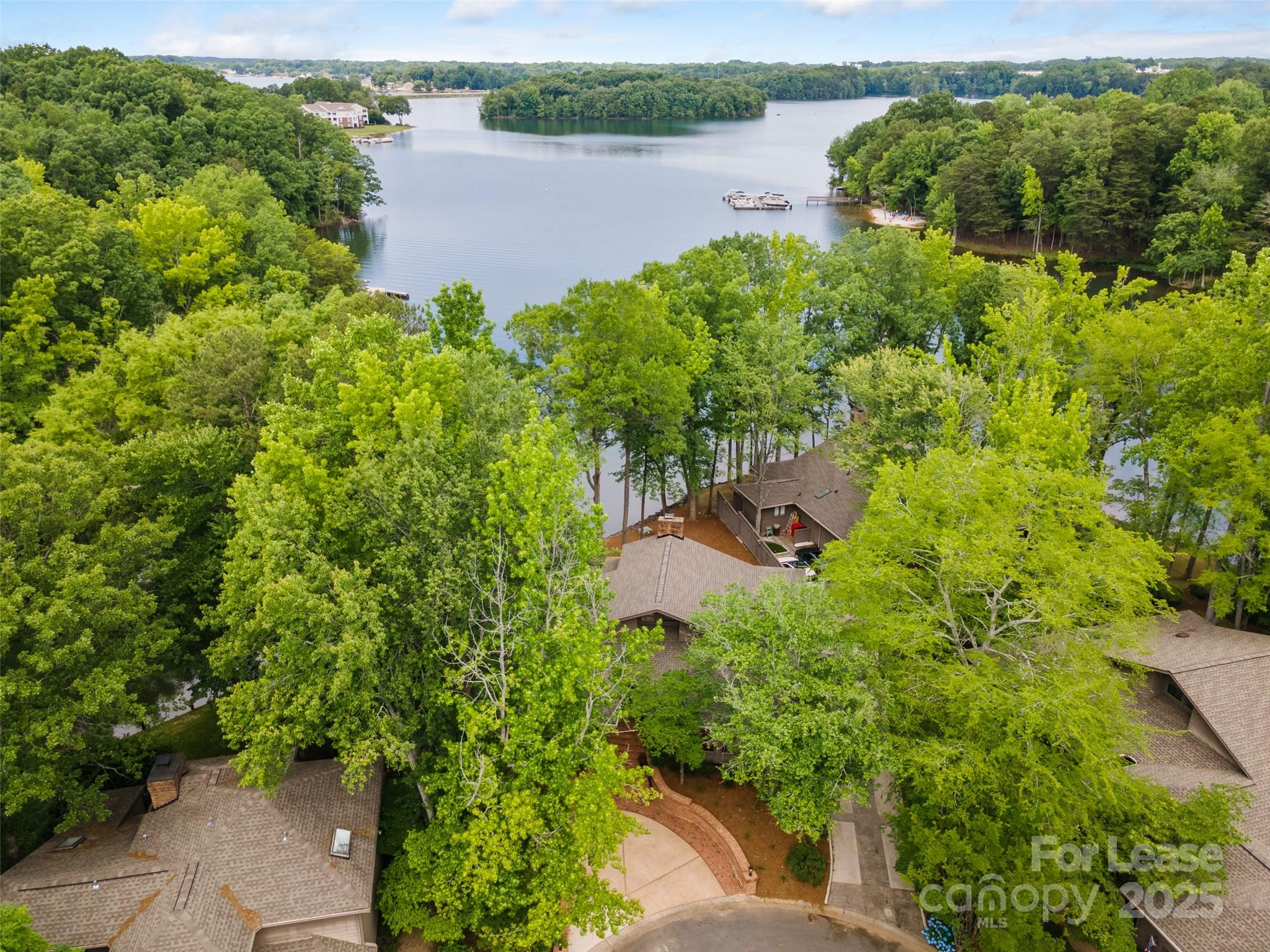 449 Windward Drive Davidson, NC 28036 - Photo 31 of 46 an aerial view of a house with a yard and lake view