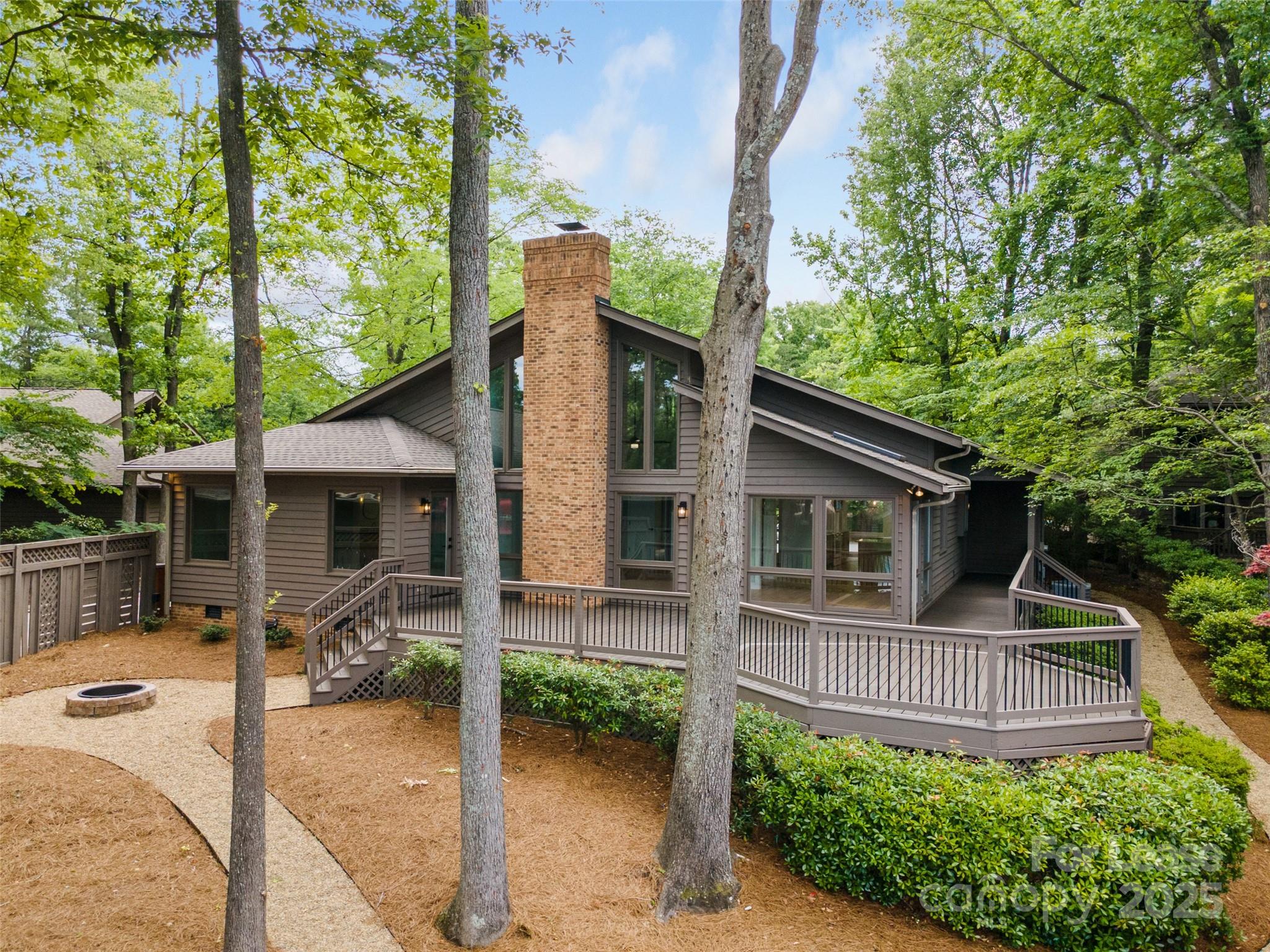 449 Windward Drive Davidson, NC 28036 - Photo 34 of 46 a view of a house with backyard and sitting area
