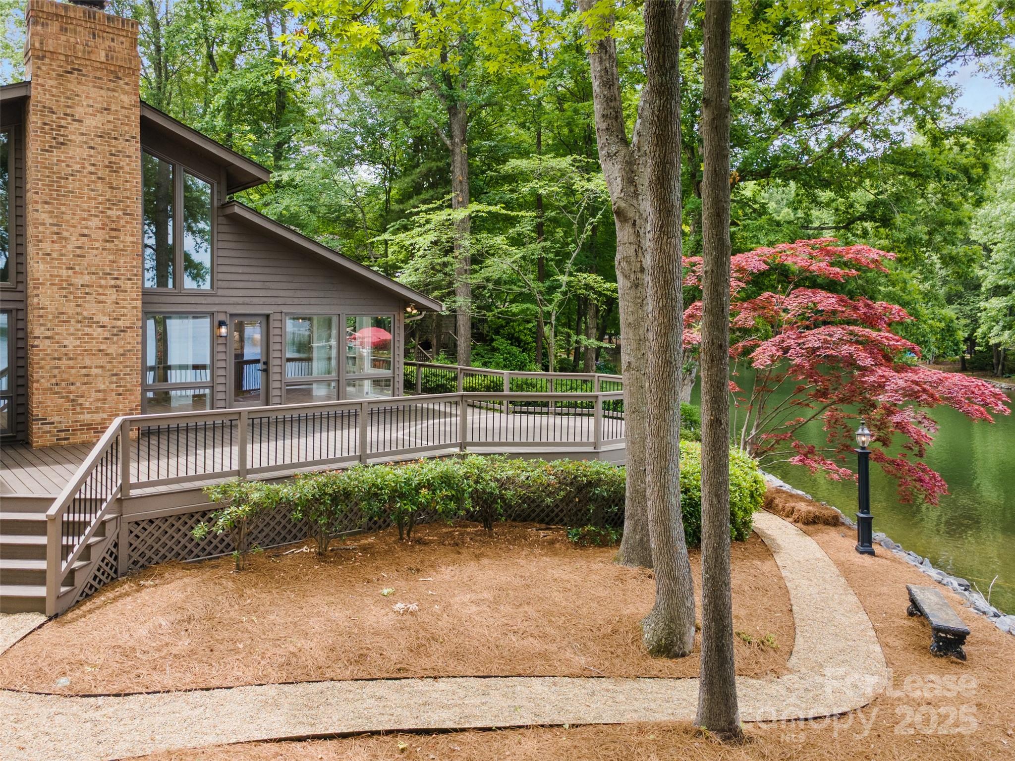 449 Windward Drive Davidson, NC 28036 - Photo 36 of 46 a view of a backyard with plants