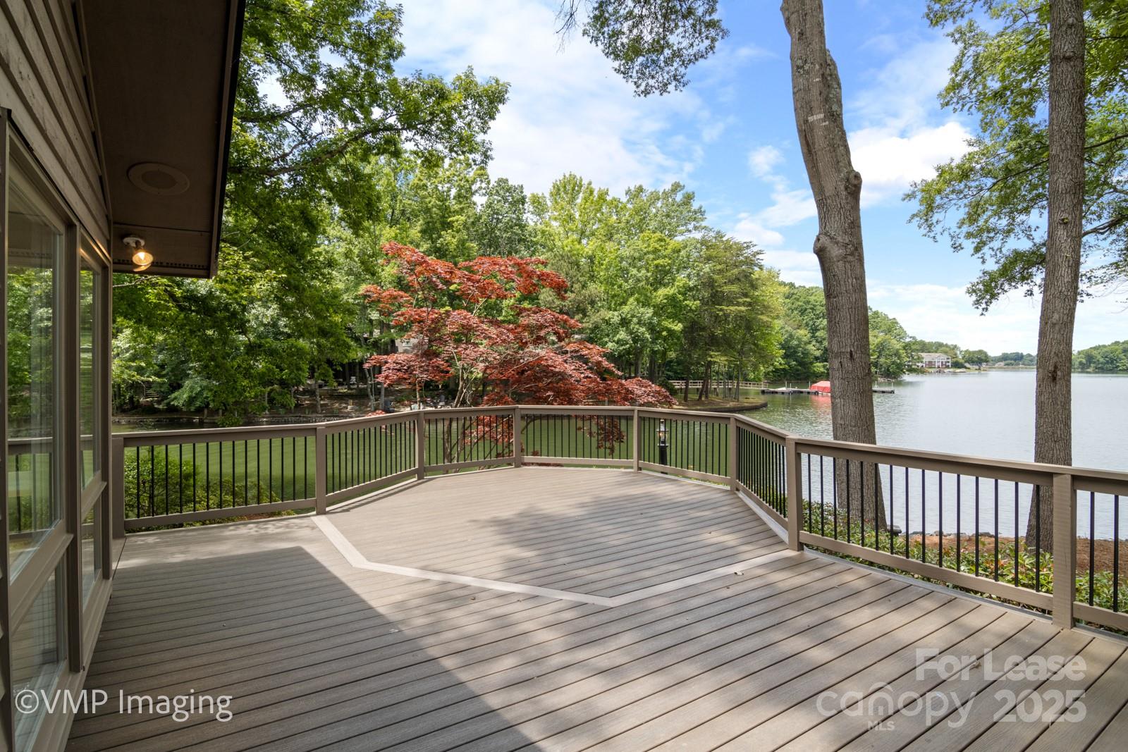 449 Windward Drive Davidson, NC 28036 - Photo 39 of 46 a view of balcony with wooden floor and fence