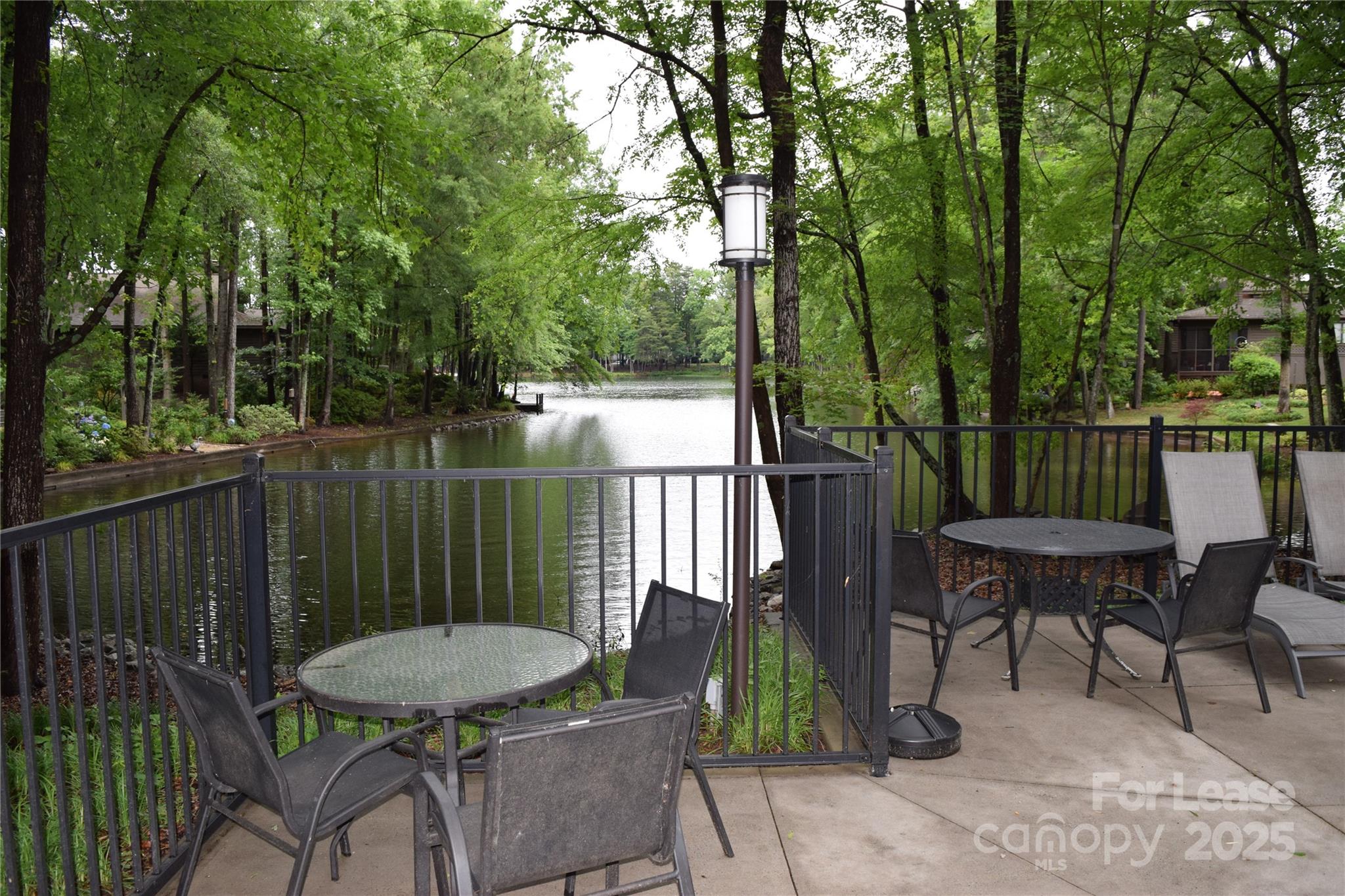 449 Windward Drive Davidson, NC 28036 - Photo 45 of 46 a view of a table and chairs in the patio