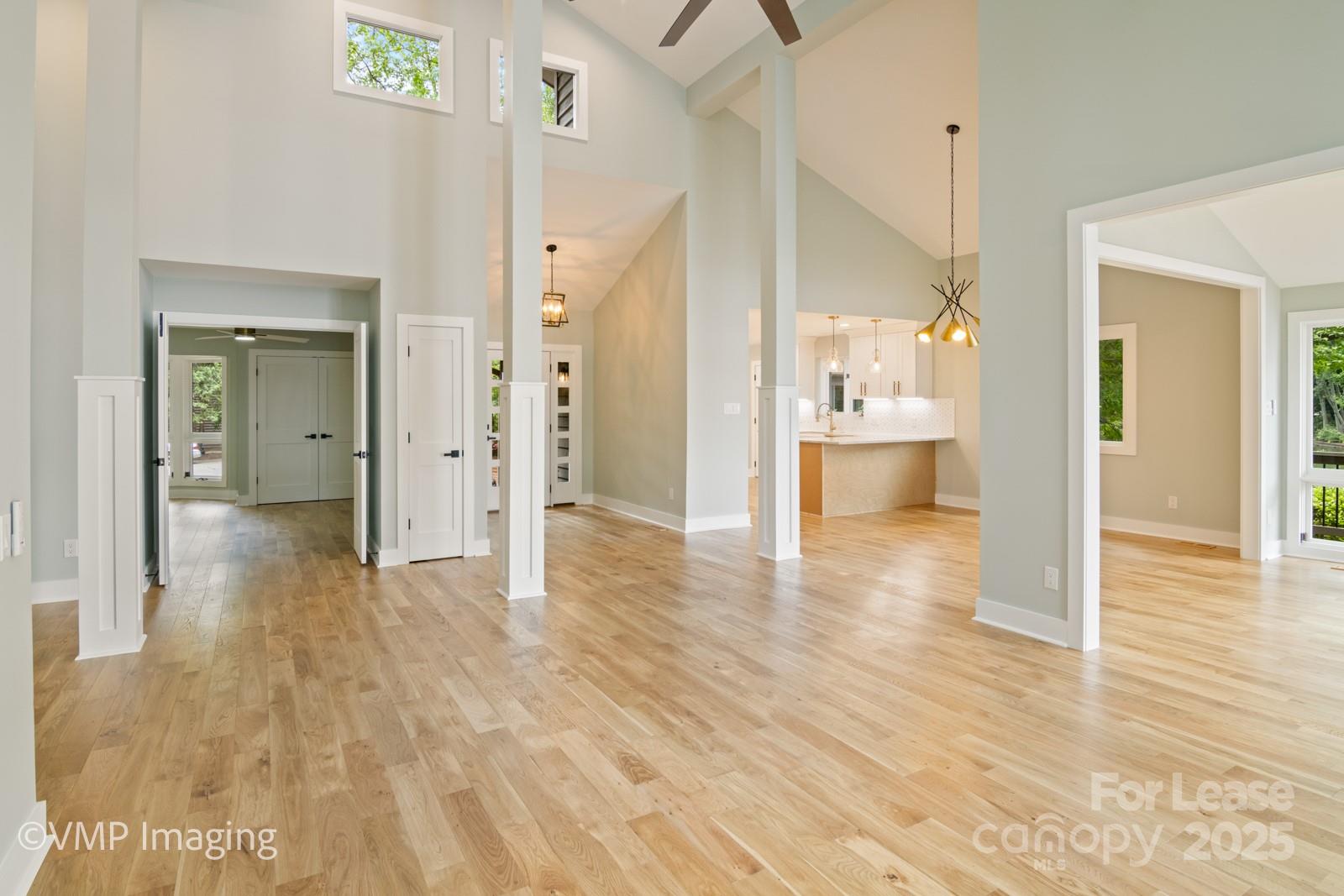 449 Windward Drive Davidson, NC 28036 - Photo 8 of 46 a view of a hallway with wooden floor windows and a bathroom