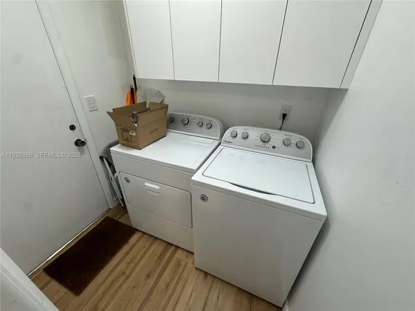 a kitchen with stainless steel appliances a stove a microwave a sink and cabinets