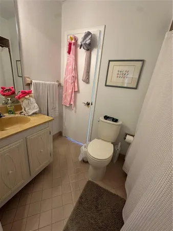 a bathroom with a toilet and a bathtub