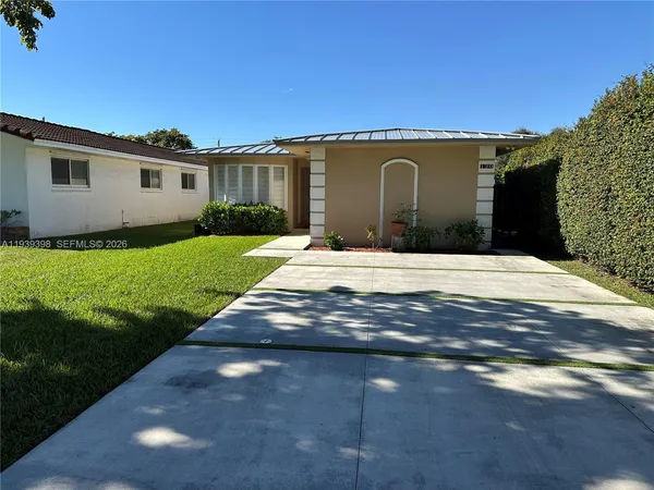 a front view of a house with yard