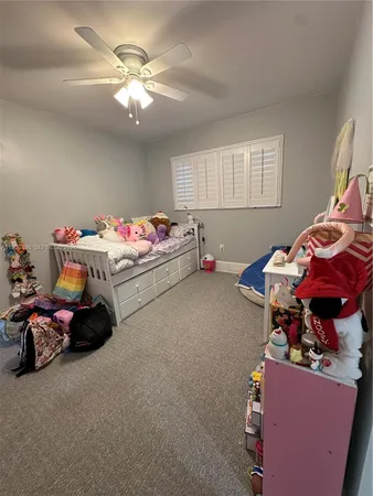 a bed room with a bed and a chandelier