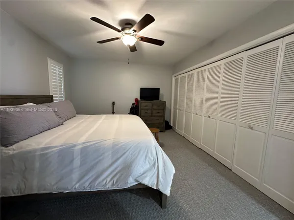 a view of a patio with a table chairs and a table