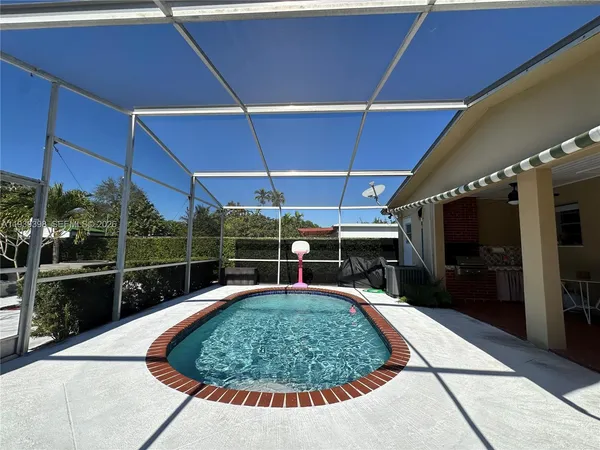 a stove top oven sitting inside of a kitchen