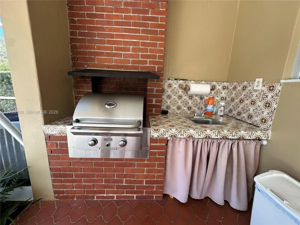 a view of backyard with swimming pool and outdoor seating