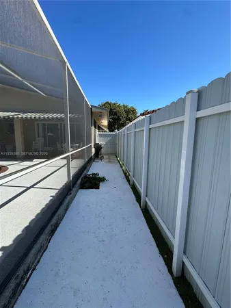 a view of a backyard with sitting area