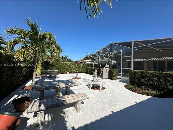 a view of backyard with sitting area