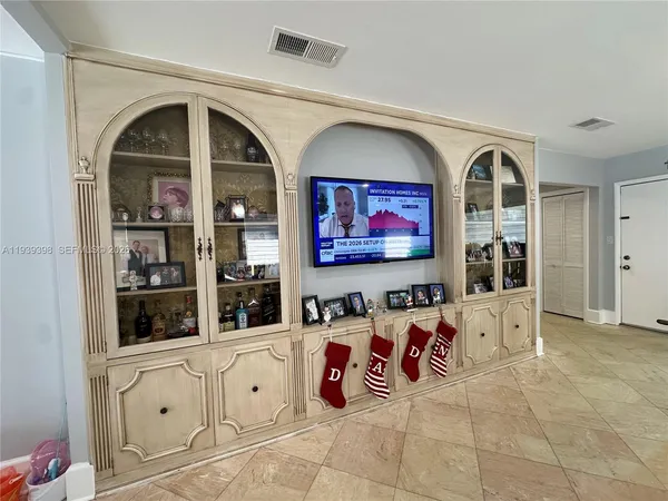 a view of a living room with kitchen