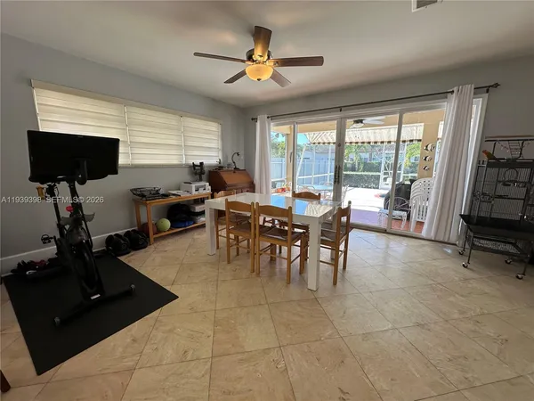 a kitchen with a sink a refrigerator and cabinets