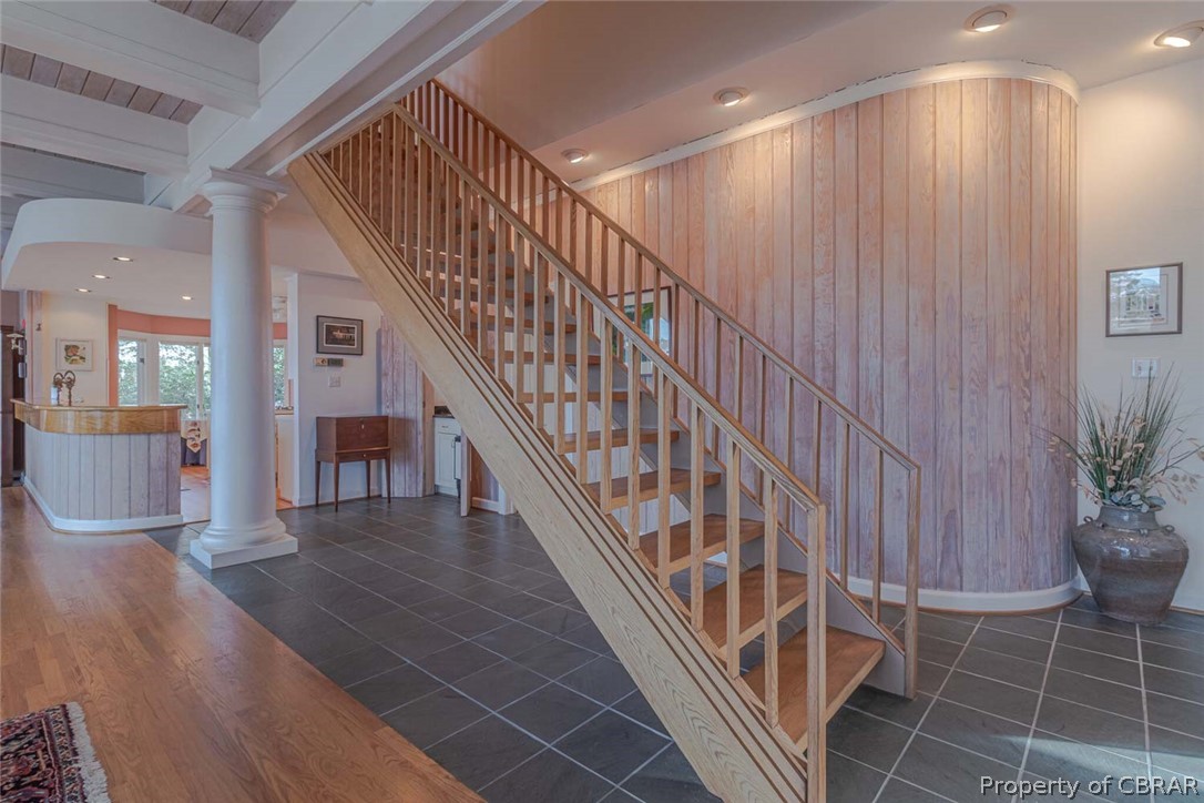 1028 Blueberry Point Road White Stone, VA 22578 - Photo 39 of 49 Floating staircase near the rounded wooden wall, beautiful & unique design. 4 Bedrooms, 2 Full bathrooms upstairs & More!