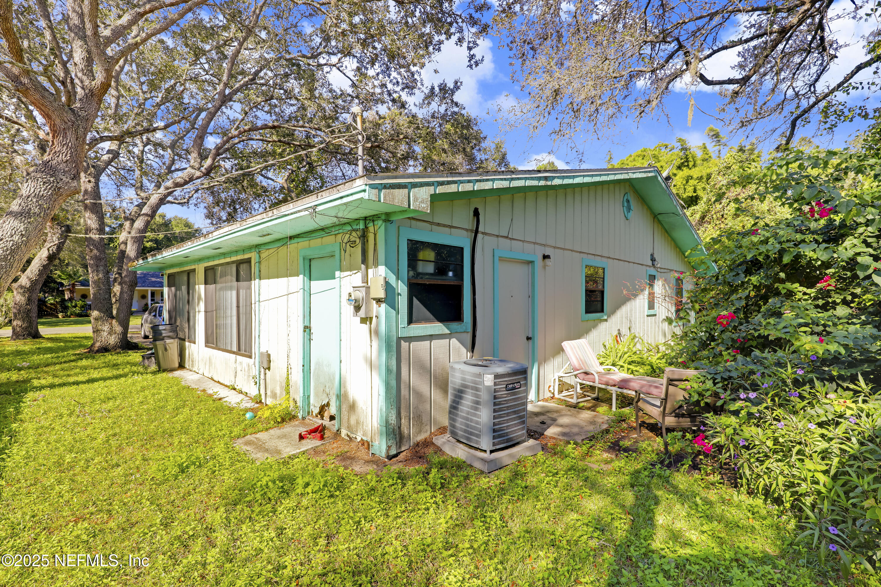 229 Bonita Road St. Augustine, FL 32086 - Photo 8 of 9 a front view of a house with garden