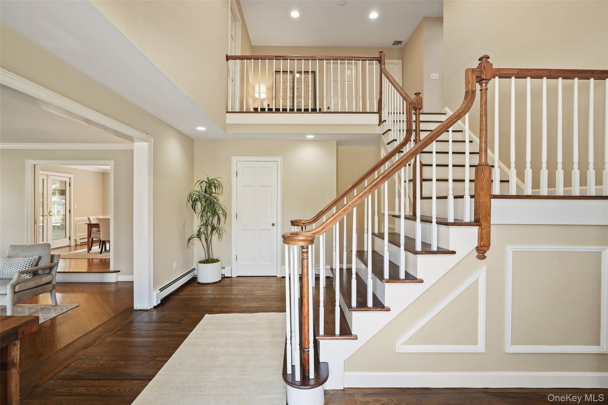 175 Finch Road North Salem, NY 10560 - Photo 20 of 44 a view of staircase with lots of frames on wall and couches