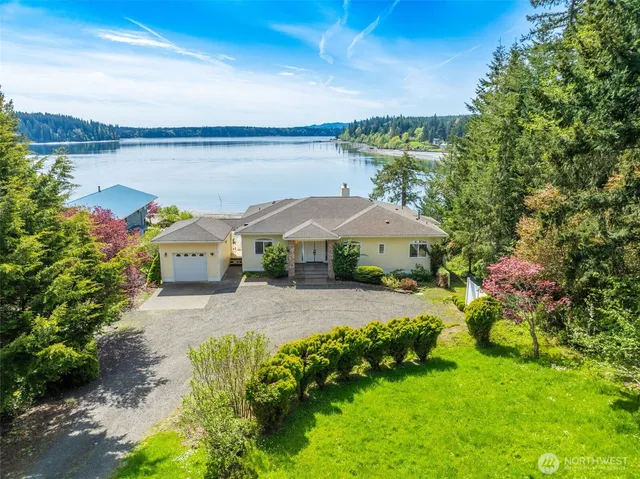 a view of a house with a yard and garden