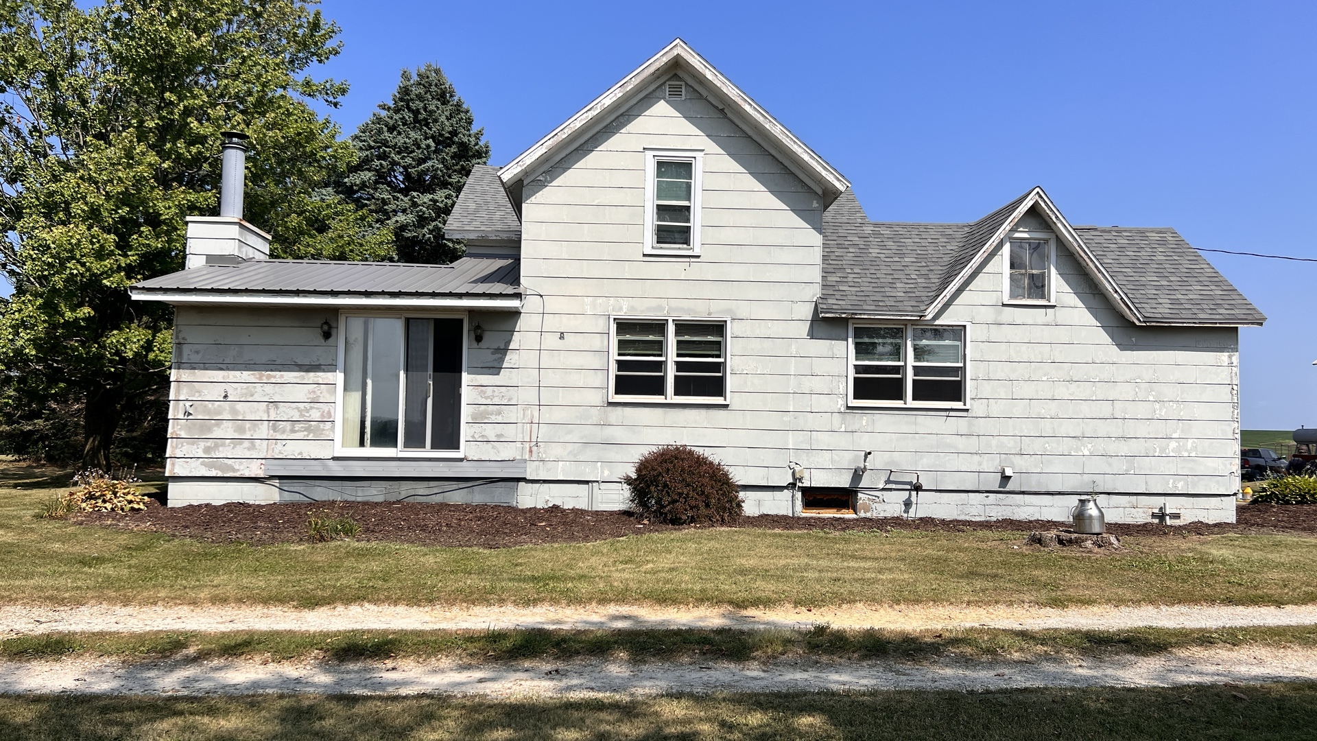 23160 Carroll Road Morrison, IL 61270 - Photo 20 of 44 a view of a house with a yard and sitting area