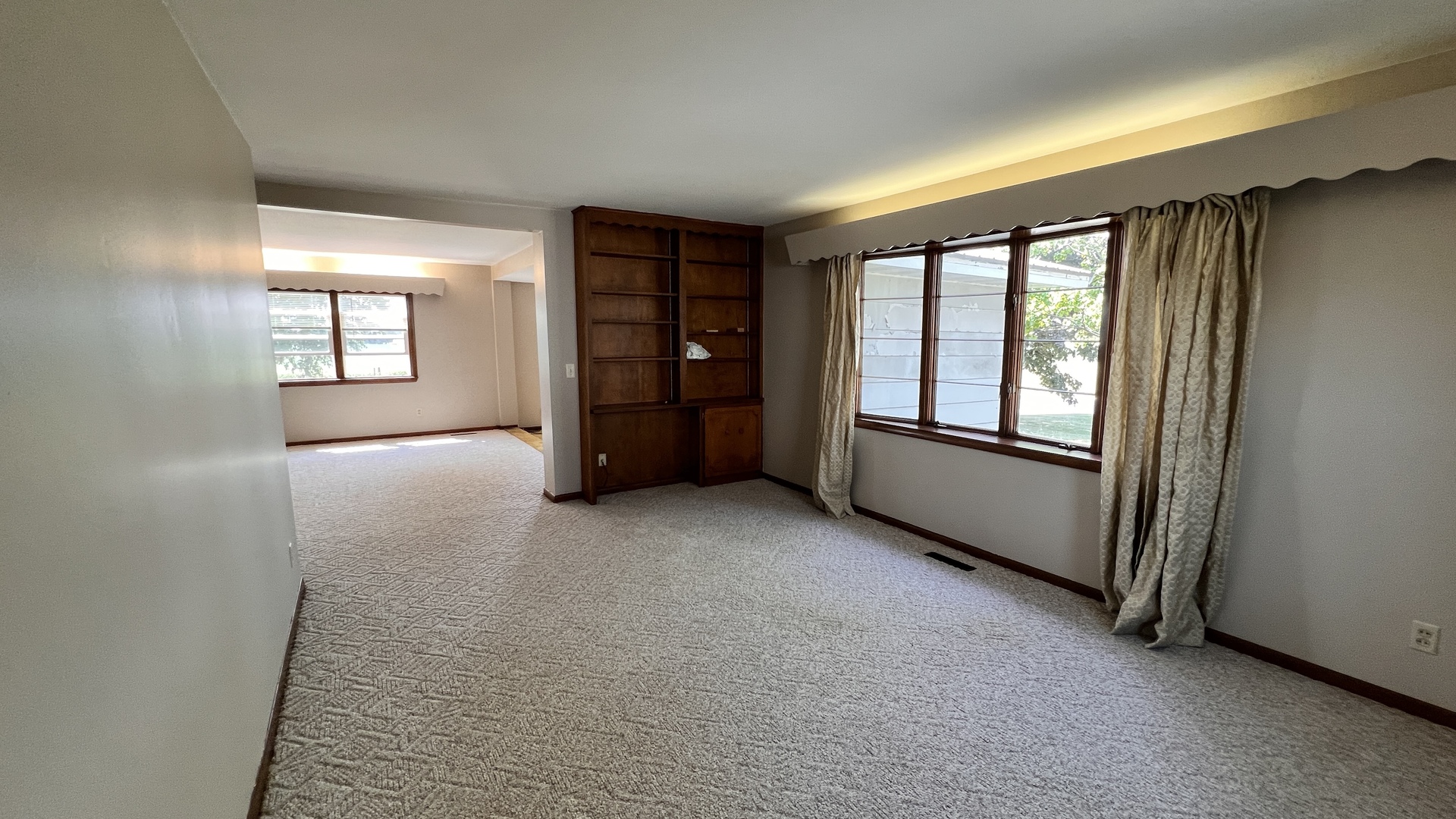 23160 Carroll Road Morrison, IL 61270 - Photo 23 of 44 a view of an empty room with a window and a kitchen