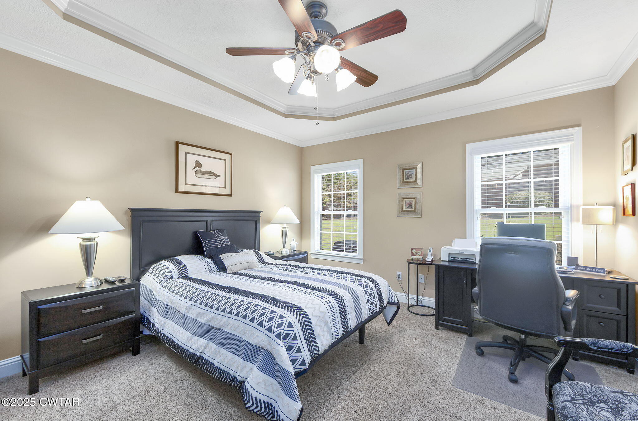 188 Quail Ridge Jackson, TN 38305 - Photo 12 of 29 a bedroom with a bed and a chandelier