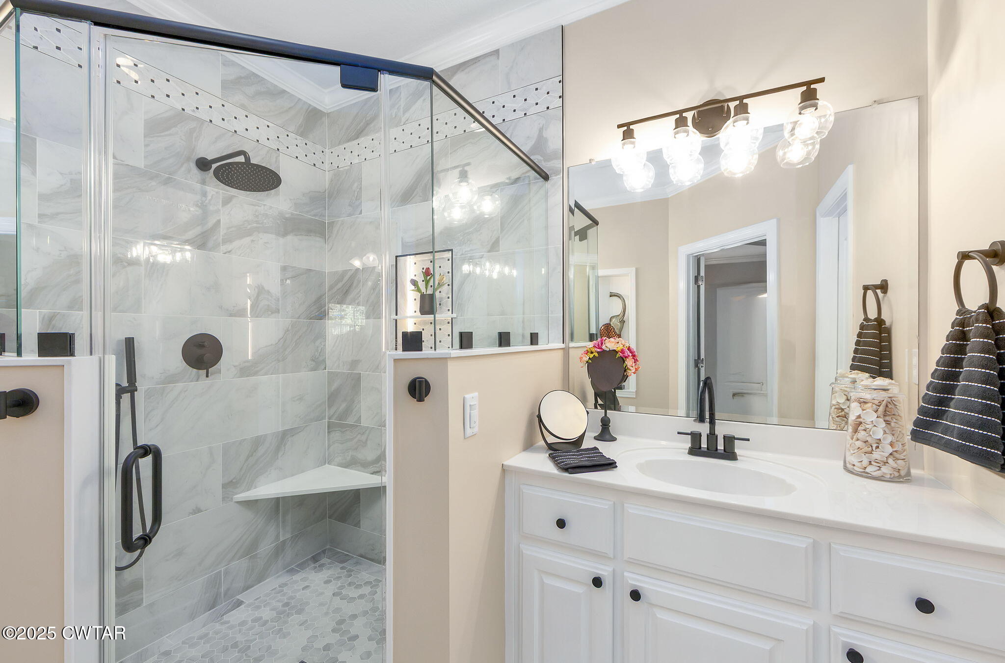188 Quail Ridge Jackson, TN 38305 - Photo 16 of 29 a bathroom with a double vanity sink mirror and shower