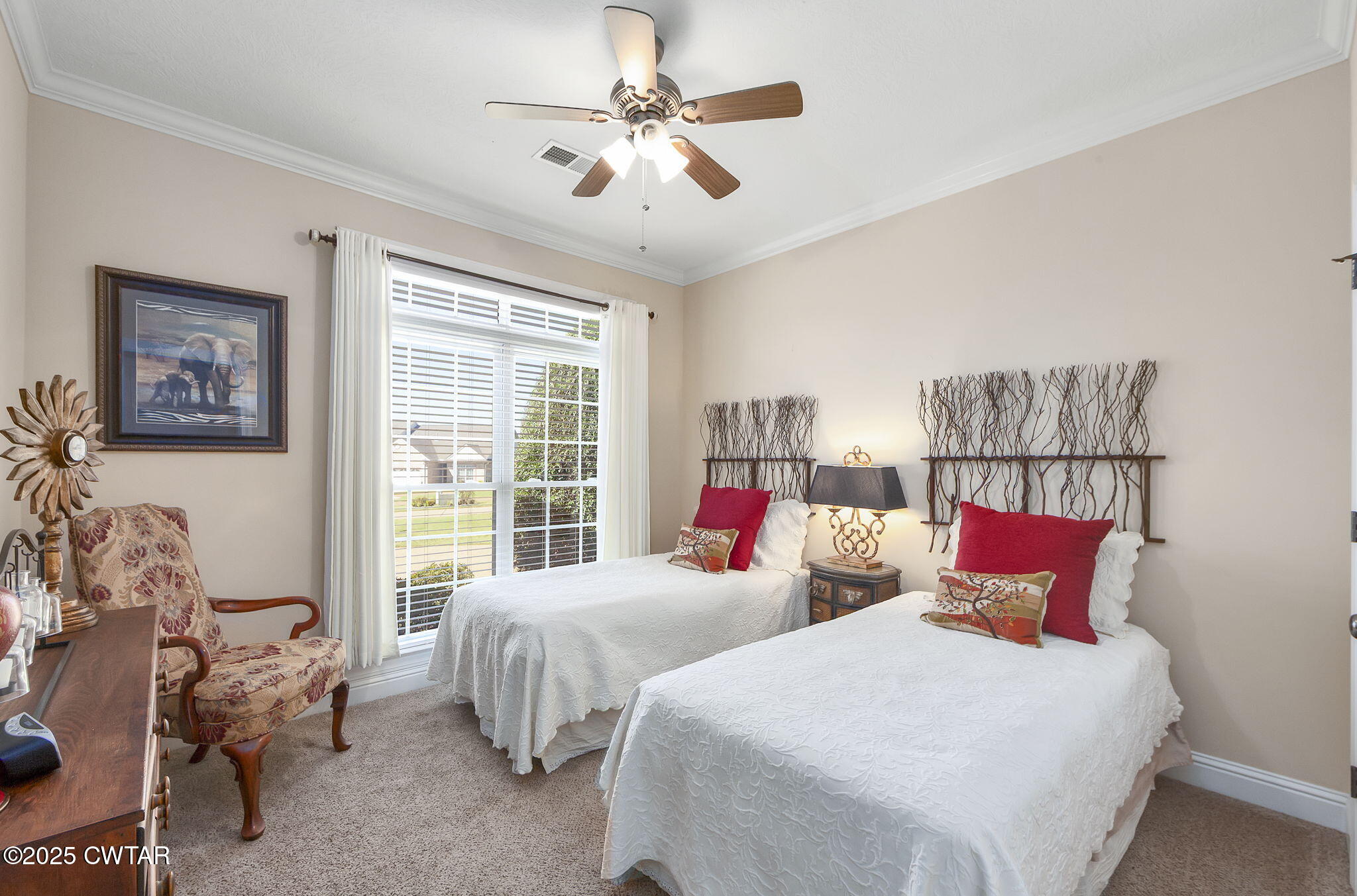 188 Quail Ridge Jackson, TN 38305 - Photo 19 of 29 a bedroom with two beds and a large window