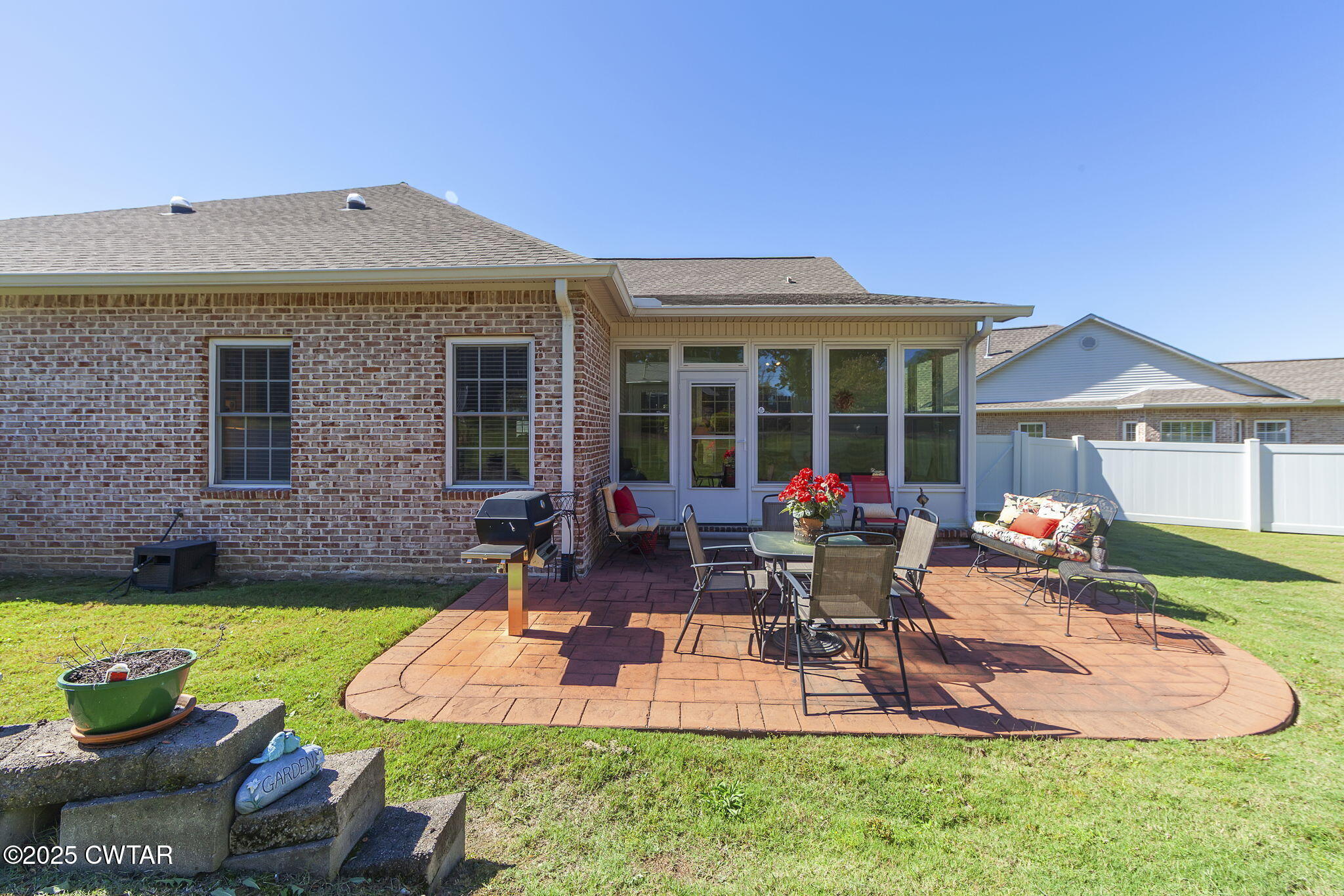 188 Quail Ridge Jackson, TN 38305 - Photo 25 of 29 a view of a house with backyard sitting area and swimming pool