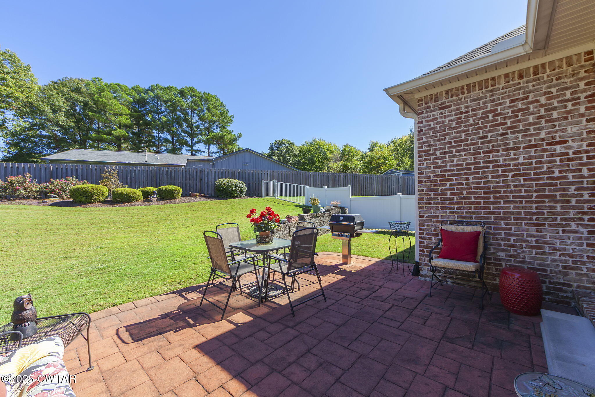 188 Quail Ridge Jackson, TN 38305 - Photo 28 of 29 a view of a chairs and table in patio with a lake view