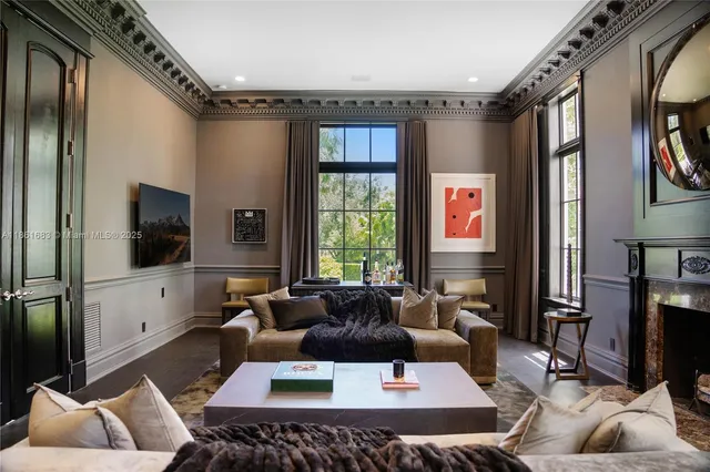 a living room with furniture and a window