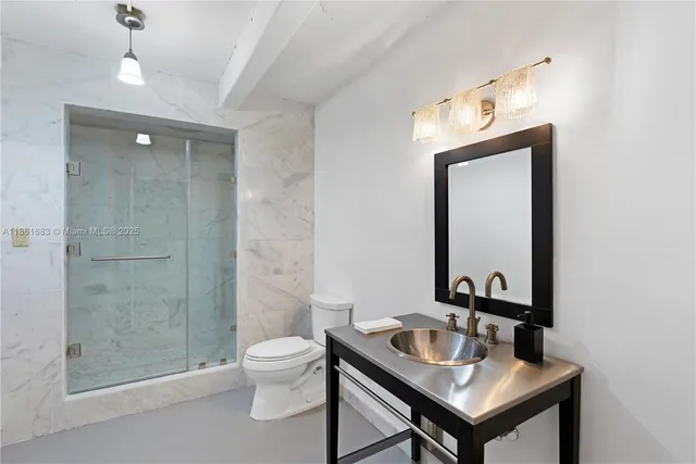 an aerial view of a house with outdoor space