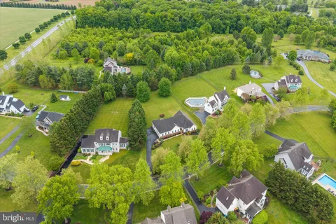 an aerial view of ocean residential houses with outdoor space and swimming pool