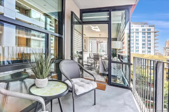 a view of a livingroom with furniture and a potted plant