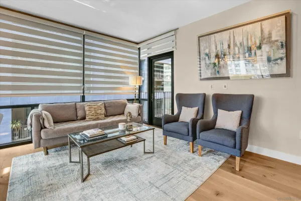 a living room with furniture and a large window