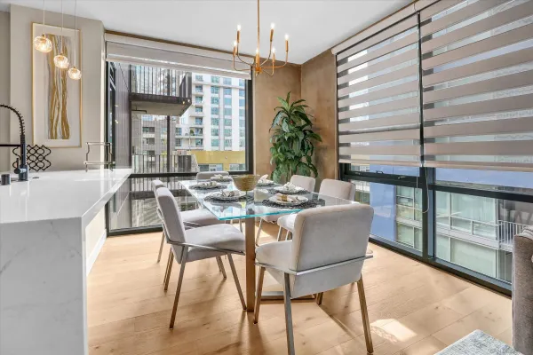 a dining room with furniture and window