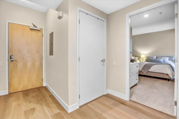 a view of a bedroom from a hallway