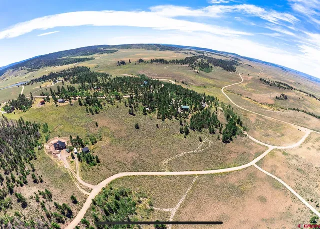 a view of a swimming pool with a mountain from a balcony