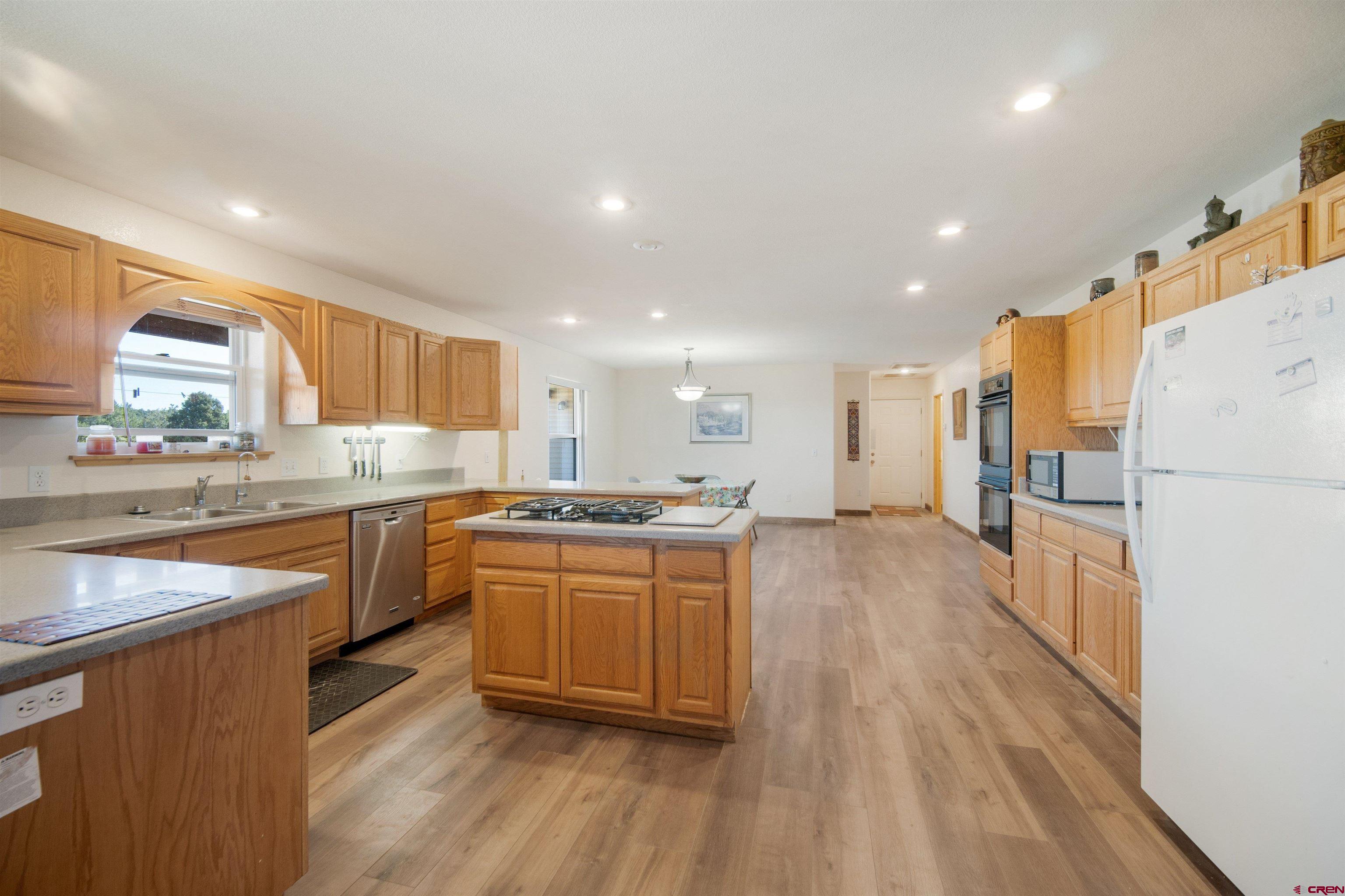 660 Road 8k Egnar, CO 81325 - Photo 12 of 30 a kitchen with stainless steel appliances granite countertop a stove and a refrigerator