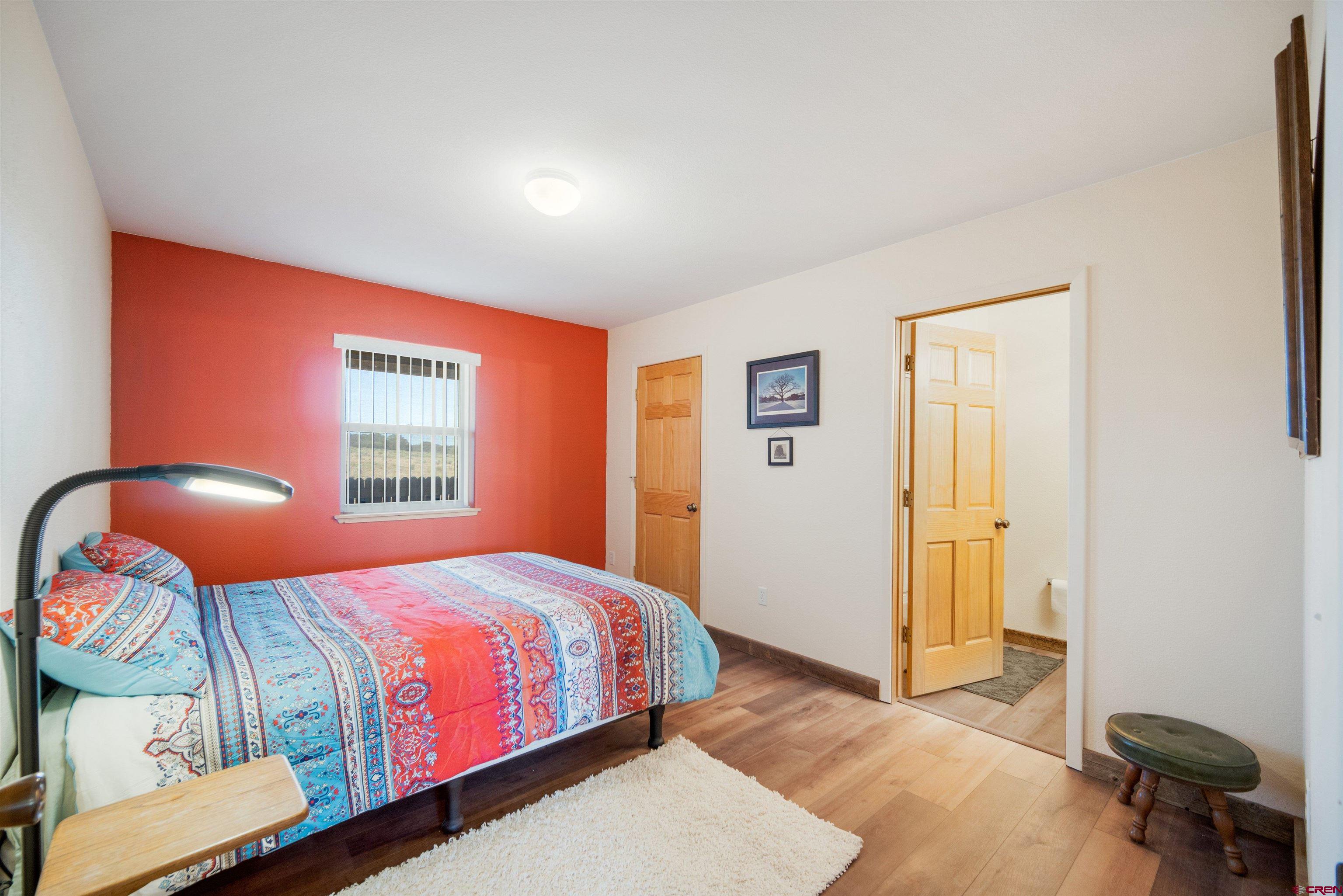 660 Road 8k Egnar, CO 81325 - Photo 30 of 30 a bedroom with a bed and a window