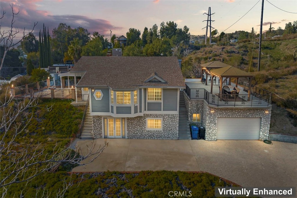 7223 Tranquil Place Tujunga, CA 91042 - Photo 1 of 40 a front view of a house with a yard