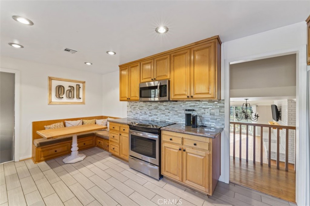 7223 Tranquil Place Tujunga, CA 91042 - Photo 12 of 40 a kitchen with a sink and wooden cabinets