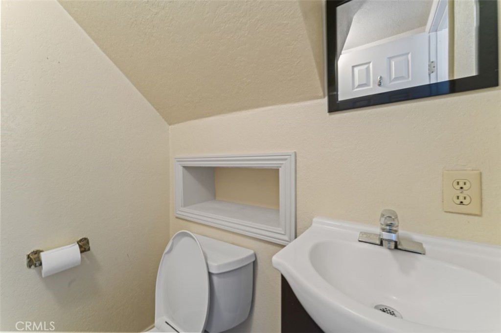 7223 Tranquil Place Tujunga, CA 91042 - Photo 15 of 40 a bathroom with a sink a toilet and mirror