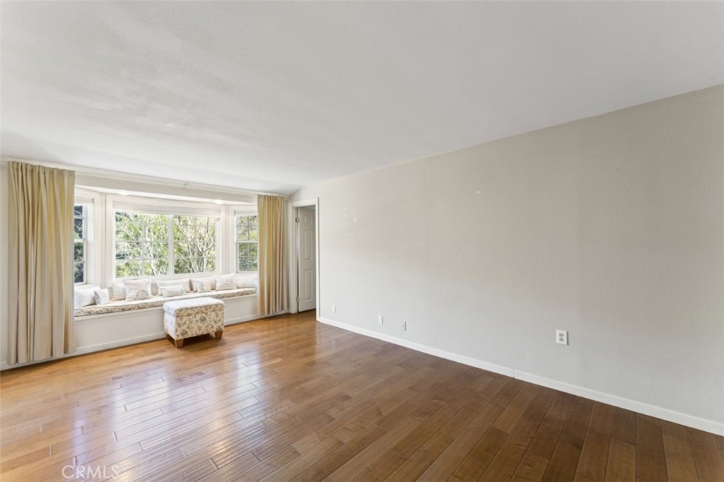 7223 Tranquil Place Tujunga, CA 91042 - Photo 16 of 40 an empty room with wooden floor and windows