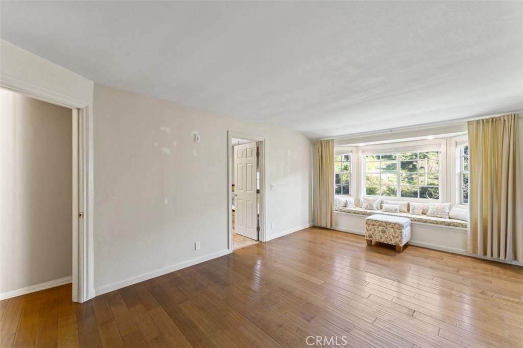 7223 Tranquil Place Tujunga, CA 91042 - Photo 17 of 40 an empty room with wooden floor and windows