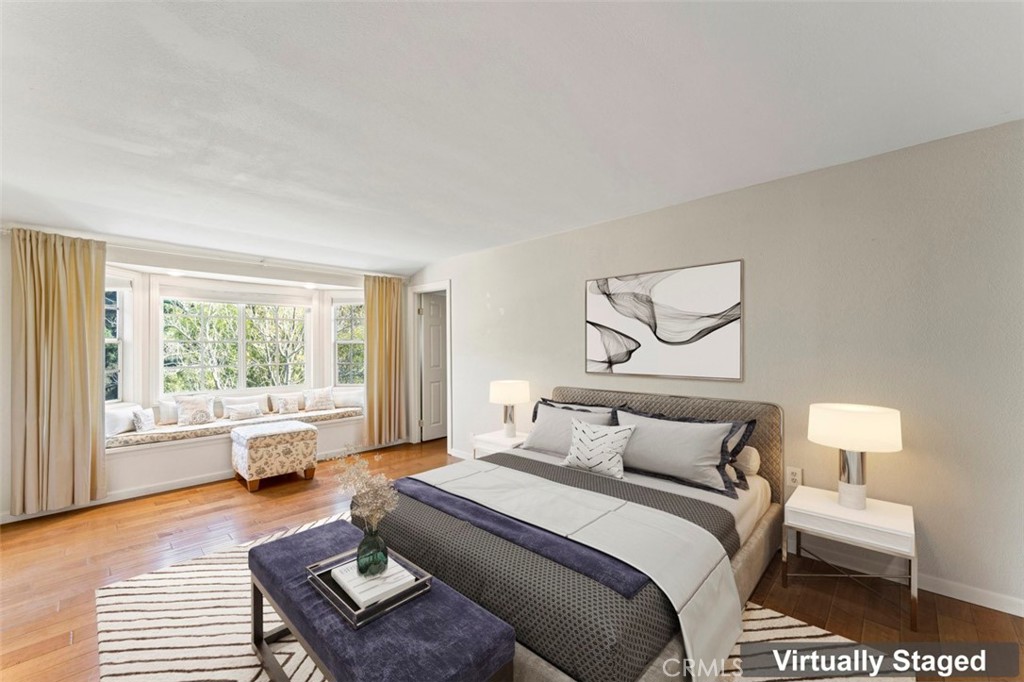 7223 Tranquil Place Tujunga, CA 91042 - Photo 23 of 40 a bedroom with furniture and a large window